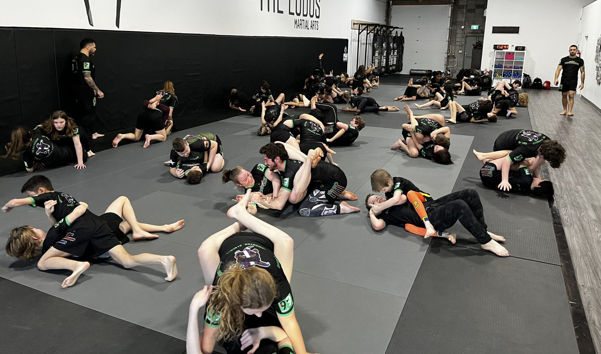 Grapplers training together on the mats